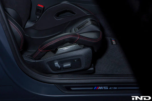 Carbon fiber seat bolster cover protectors for BMW seats.