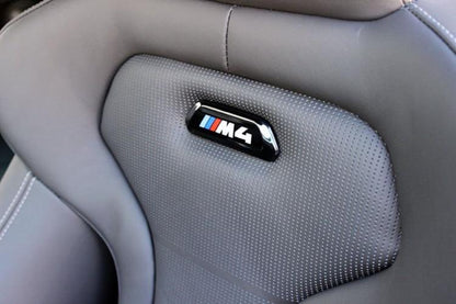 BMW F80 M3 & F82/F83 M4 OEM Black Seat Badges (Pair)